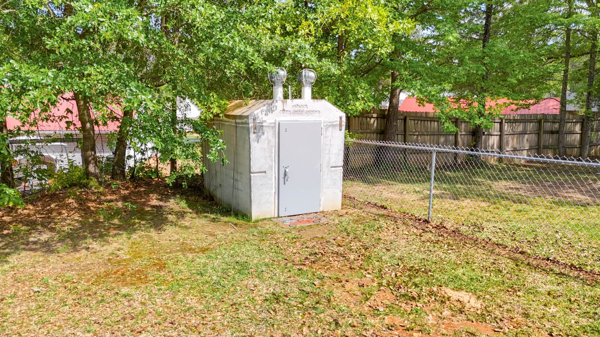 49 Cr 178 Road Iuka, MS 38852 - Photo 25 of 32 a backyard of a house with portable swimming pool and outdoor seating
