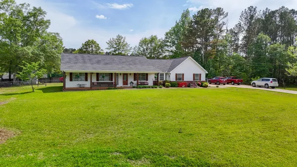 an aerial view of a house with a lake view