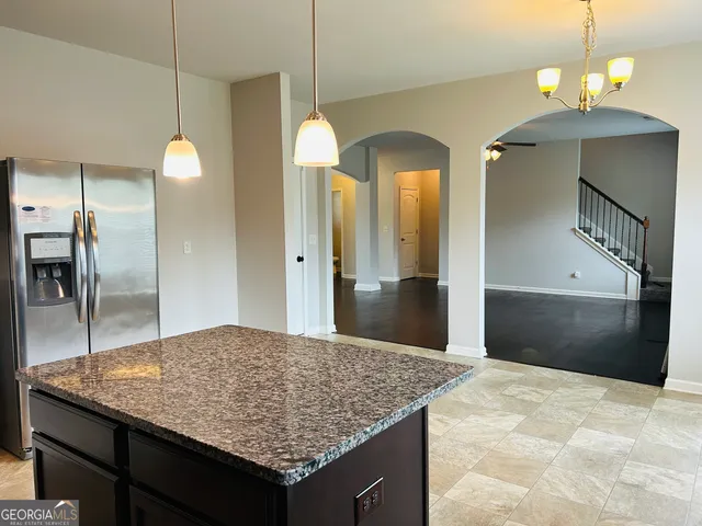a kitchen with a sink and a window
