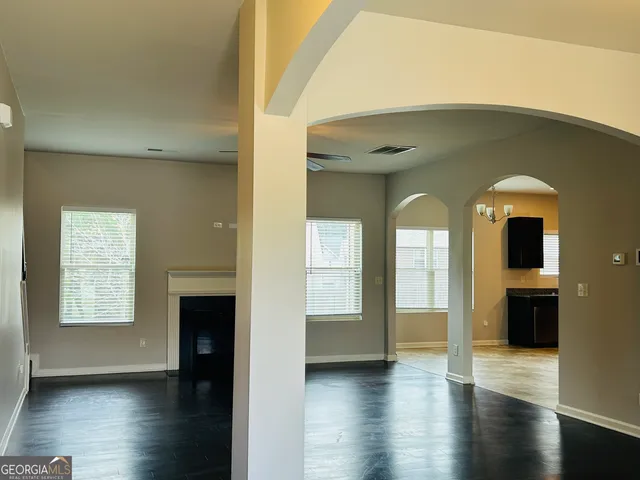 a view of entryway with livingroom and wooden floor
