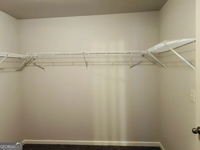 a bathroom with a double vanity sink and a toilet