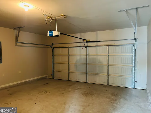 a front view of a house with garage