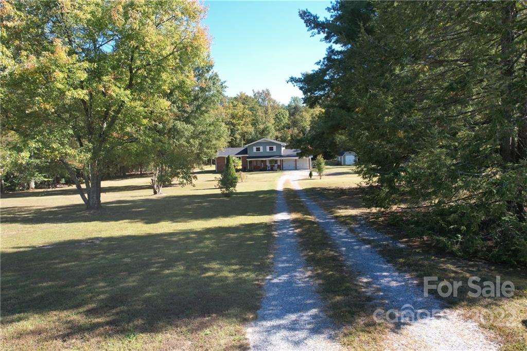 1075 Rainey Road Salisbury, NC 28146 - Photo 2 of 42 a view of a road with a yard