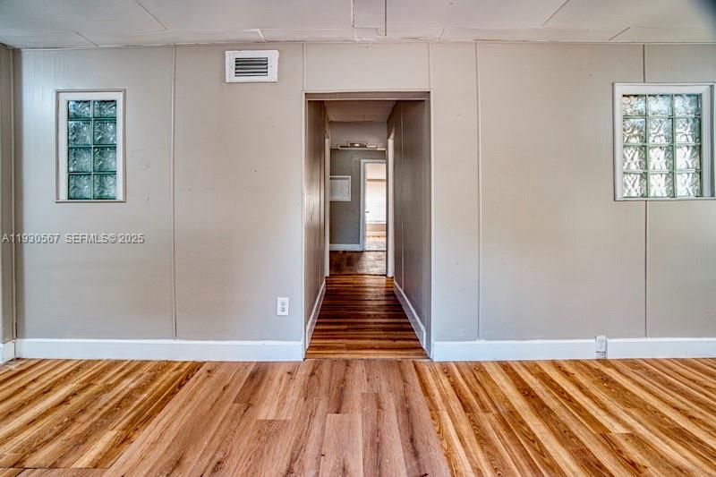 3438 Southwest 2nd Street, Unit 3438 Miami, FL 33135 - Photo 1 of 15 a view of a room with wooden floor and stairs