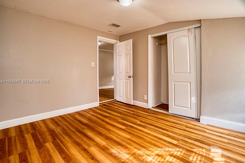 3438 Southwest 2nd Street, Unit 3438 Miami, FL 33135 - Photo 12 of 15 a view of an empty room with wooden floor