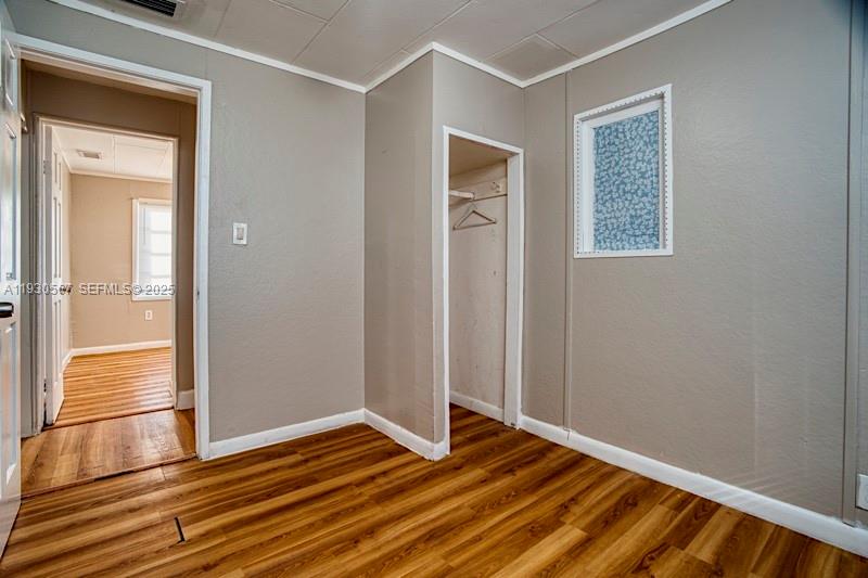 3438 Southwest 2nd Street, Unit 3438 Miami, FL 33135 - Photo 6 of 15 a view of empty room with wooden floor and fan