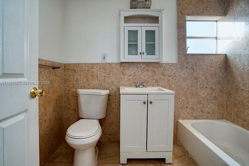 3438 Southwest 2nd Street, Unit 3438 Miami, FL 33135 - Photo 10 of 15 a bathroom with a sink toilet and bathtub