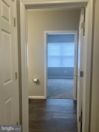 a view of room with wooden floor