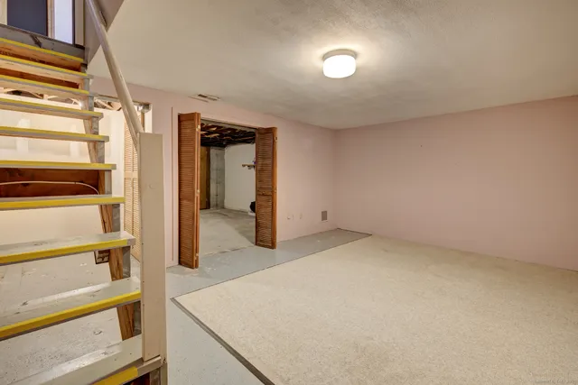 an empty room with closet area