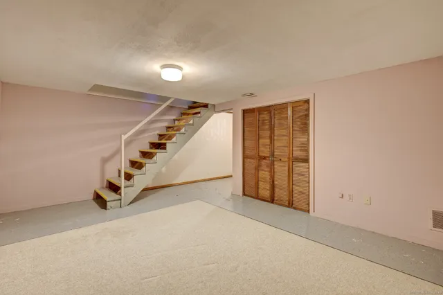 a view of a room with wooden walls