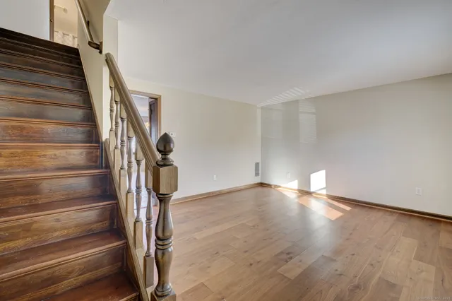 a view of an entryway with wooden floor