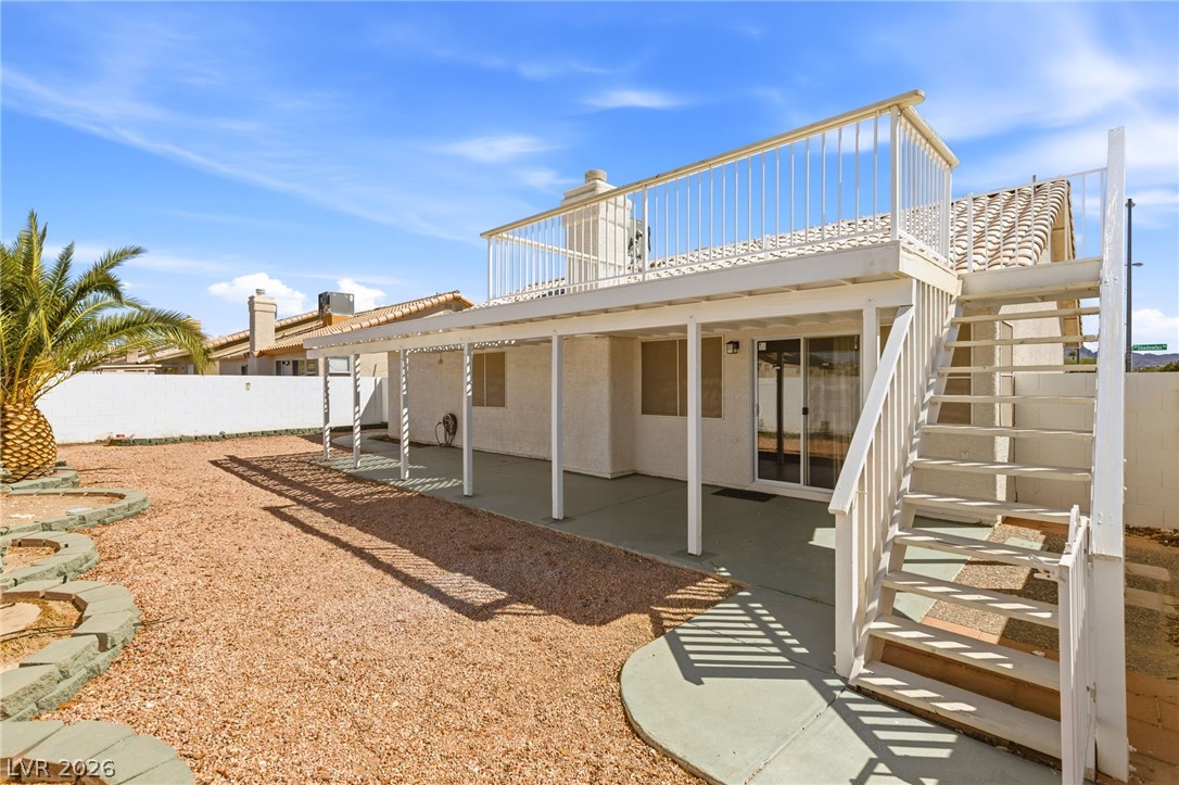 904 Shadowfax Road Henderson, NV 89015 - Photo 25 of 31 An upper balcony and covered patio overlook the low-maintenance desert yard.