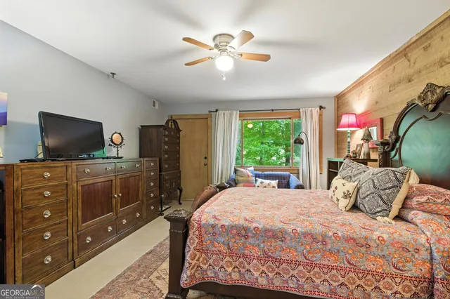 a view of a porch with furniture and wooden floor