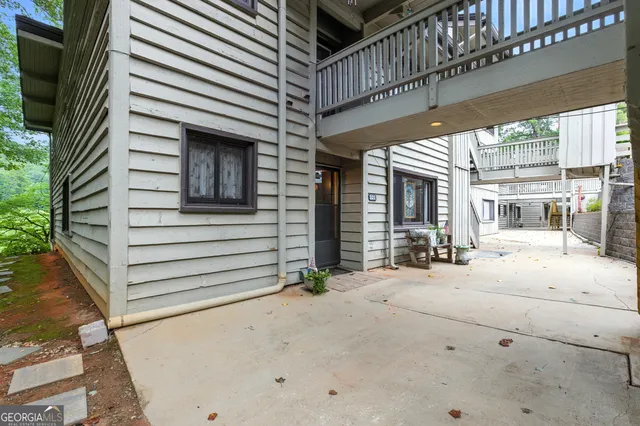 a view of a hallway with furniture and entryway