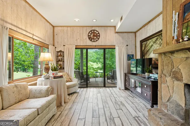 a kitchen with stainless steel appliances a stove microwave and sink