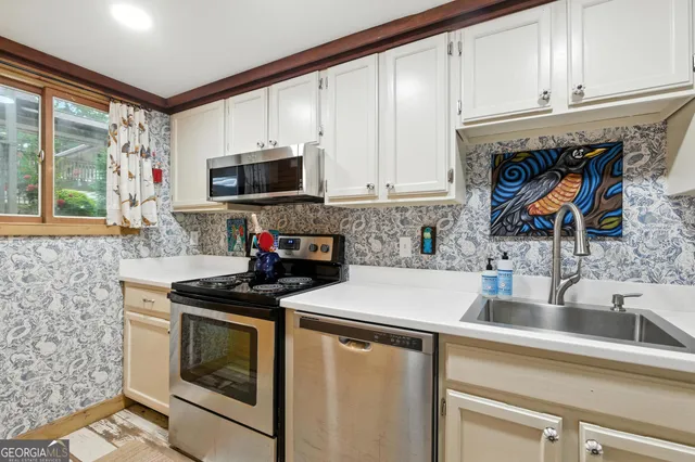a kitchen with a stove and a microwave
