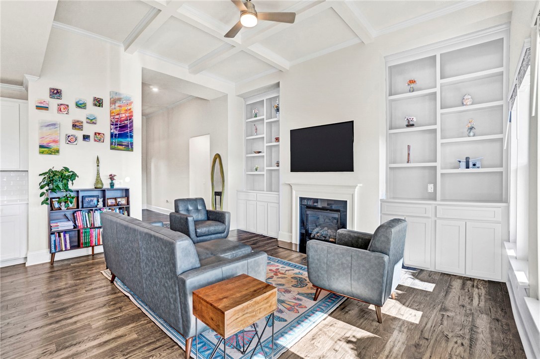 142 Juniper Hill Drive Easley, SC 29642 - Photo 20 of 47 This bright living space showcases beautiful hardwood floors and a cozy fireplace, perfect for relaxation.