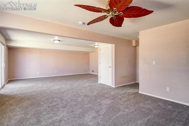 3579 Indigo Ridge Point Colorado Springs, CO 80910 - Photo 19 of 33 Recreation room in basement with walk out to covered patio