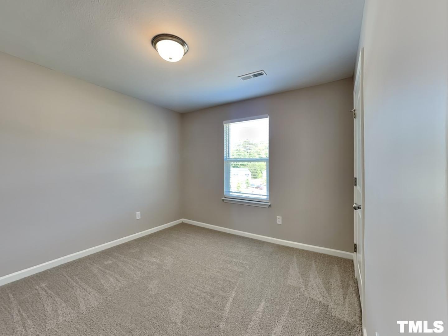 1908 Buffalo Way Durham, NC 27704 - Photo 13 of 18 an empty room with a window
