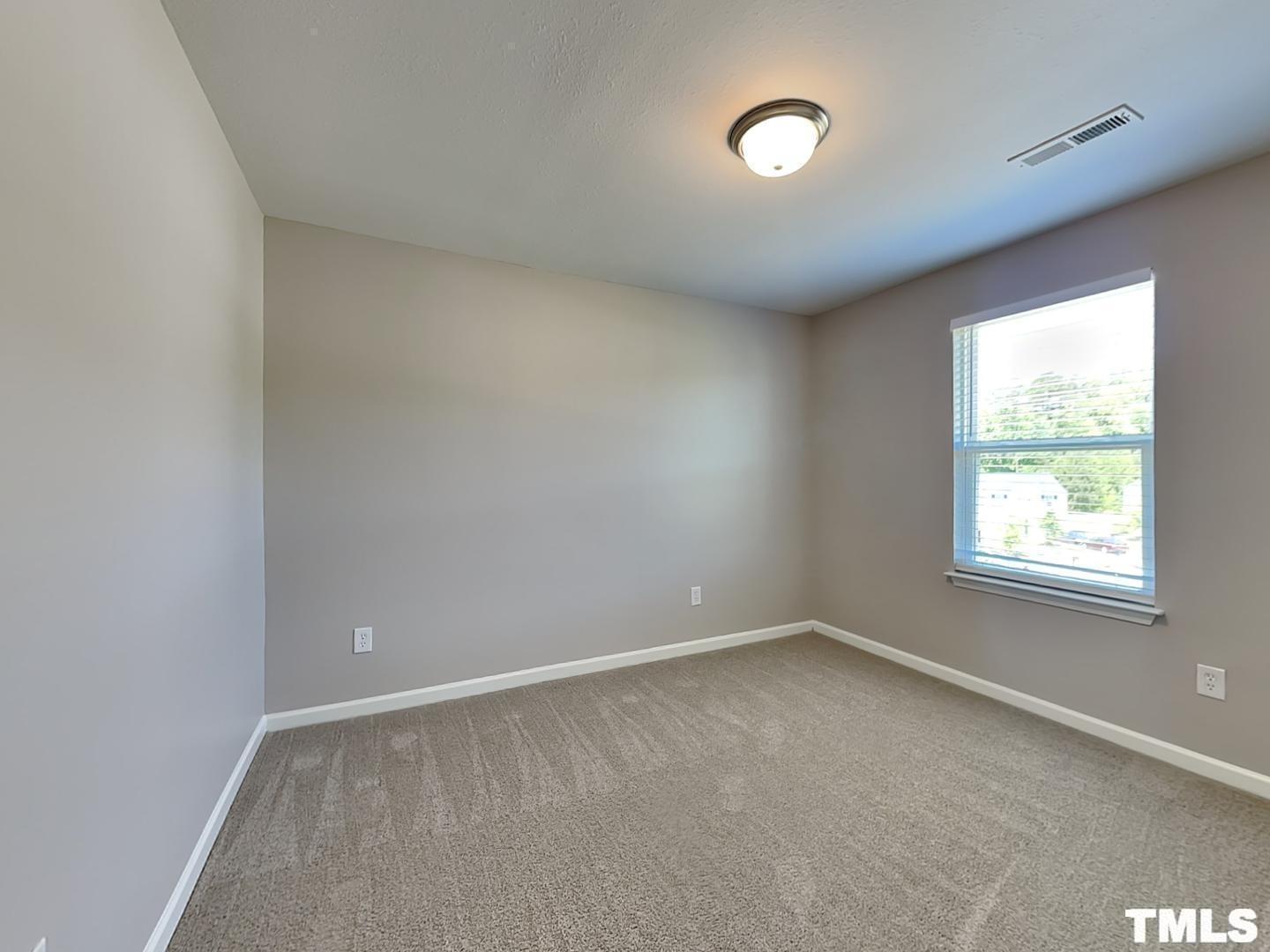 1908 Buffalo Way Durham, NC 27704 - Photo 14 of 18 an empty room with a window