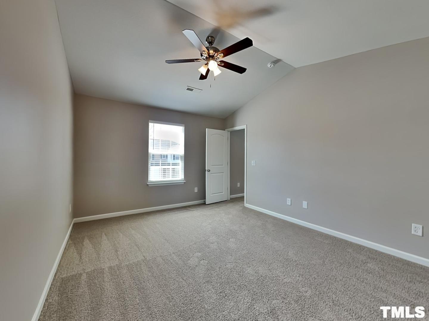 1908 Buffalo Way Durham, NC 27704 - Photo 10 of 18 a view of an empty room with a ceiling fan