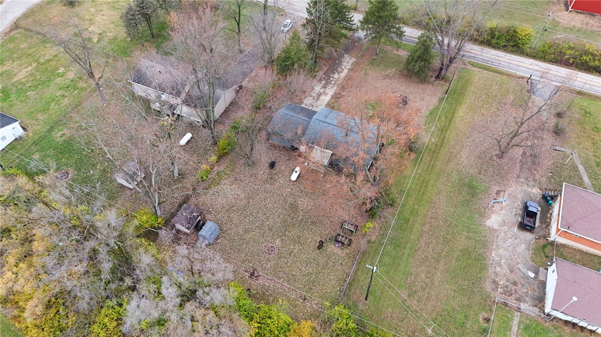 8180 Manning Road Germantown, OH 45327 - Photo 3 of 39 An aerial perspective reveals a residence nestled amidst natural surroundings, offering a sense of privacy.