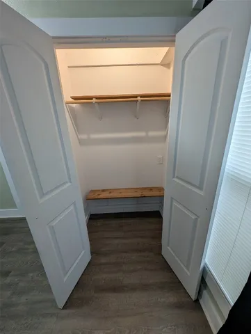 a view of entryway with wooden floor