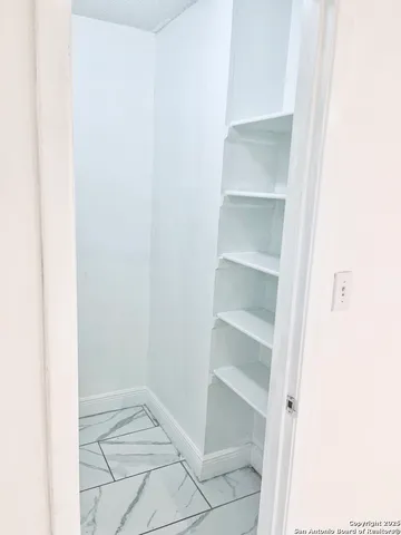 a view of an empty walk in closet