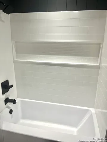 a bathroom with bathtub