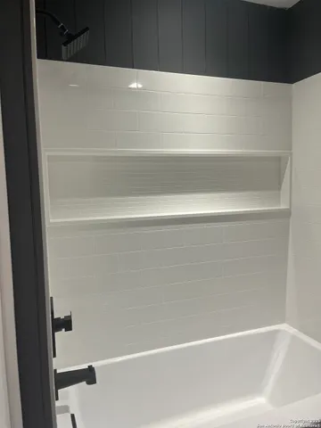 a bathroom with bathtub