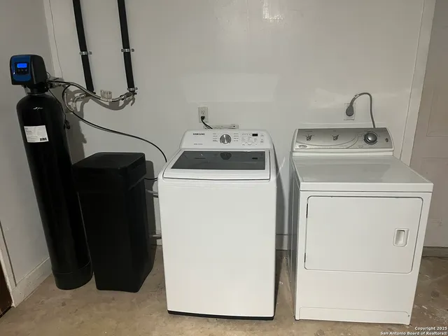 a utility room with dryer and washer