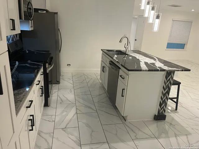 a utility room with cabinets