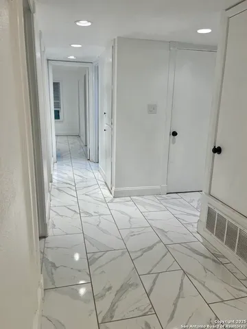 a spacious bathroom with a shower