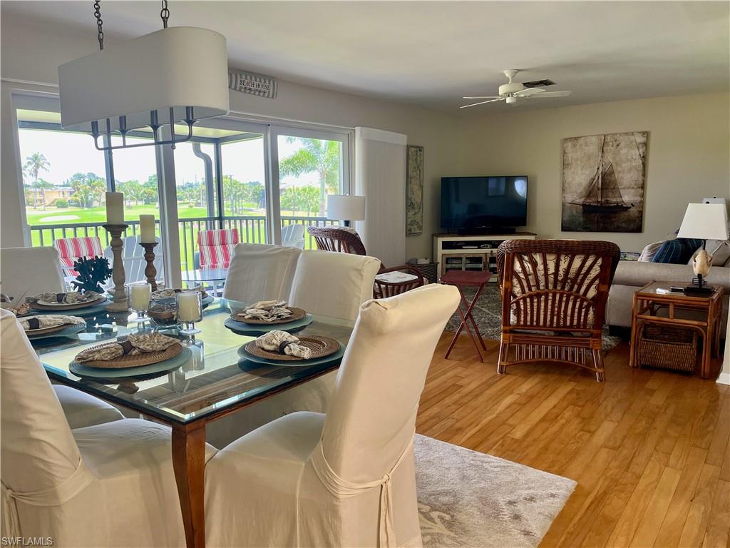 348 Tern Drive, Unit 4 Naples, FL 34112 - Photo 5 of 27 a living room with furniture and a flat screen tv