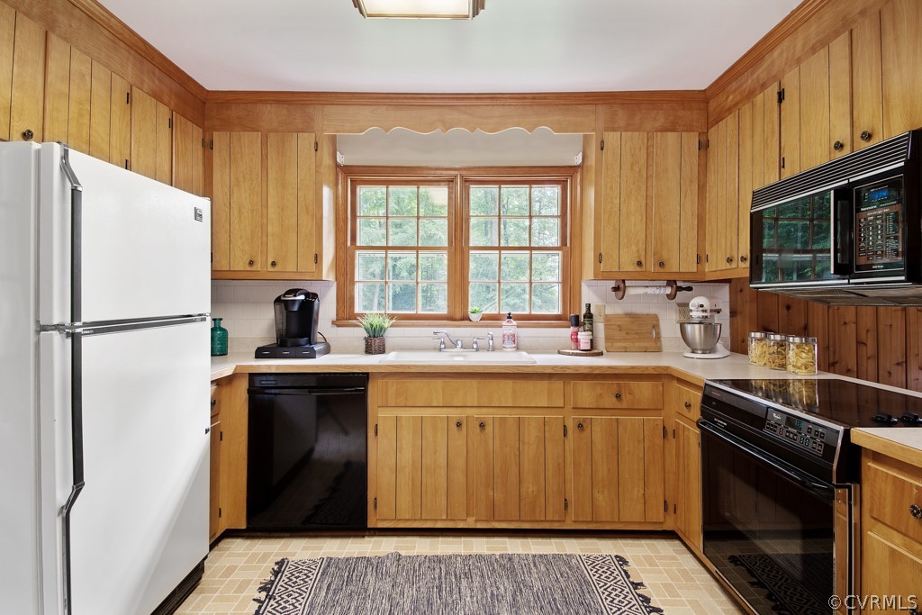 12201 Old Bailey Bridge Road Midlothian, VA 23112 - Photo 11 of 36 a kitchen with stainless steel appliances granite countertop a refrigerator sink and microwave