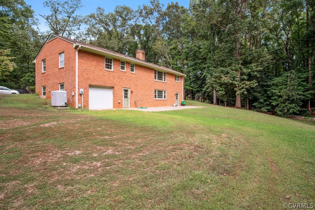 12201 Old Bailey Bridge Road Midlothian, VA 23112 - Photo 28 of 36 a front view of house with yard and trees all around