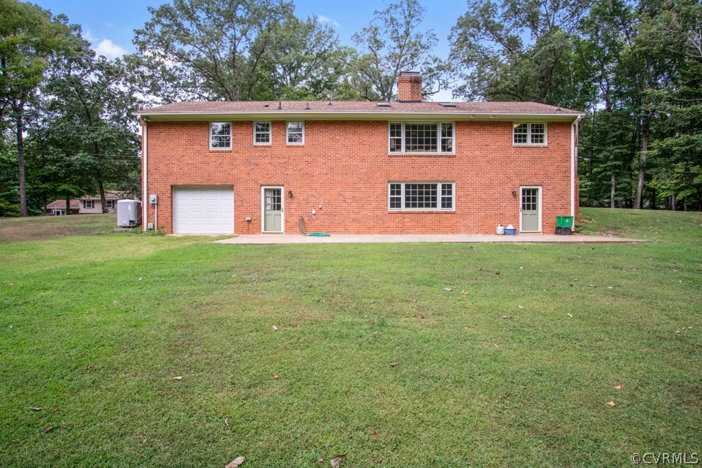 12201 Old Bailey Bridge Road Midlothian, VA 23112 - Photo 29 of 36 a front view of a house with a garden