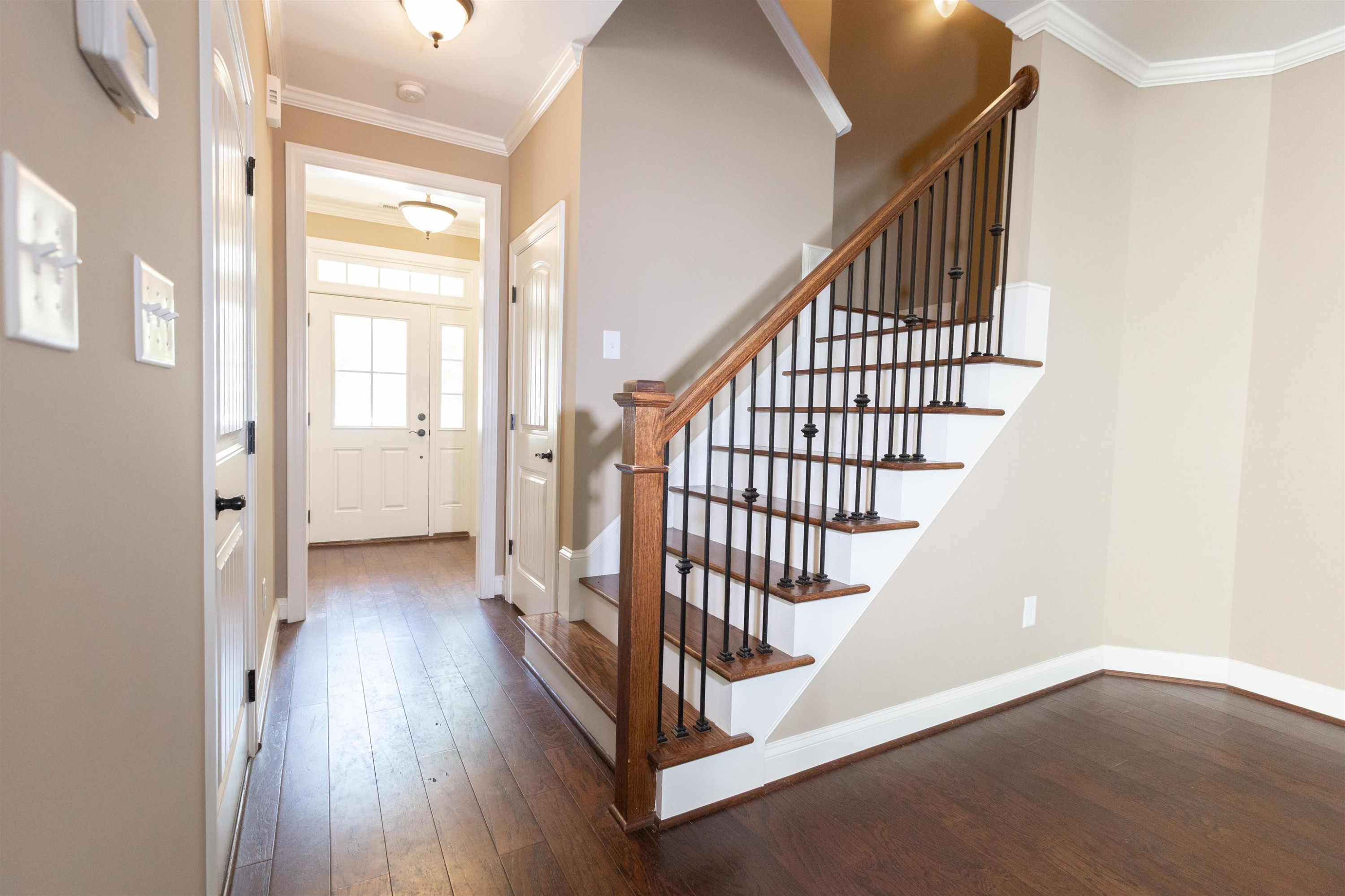 2128 Scarlet Maple Drive Raleigh, NC 27606 - Photo 2 of 17 Entry to home through one car garage across from stairs. Entryway