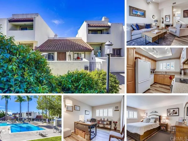 a view of multiple houses with a yard