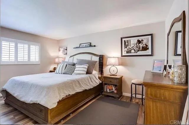 a bedroom with a bed and a table in it