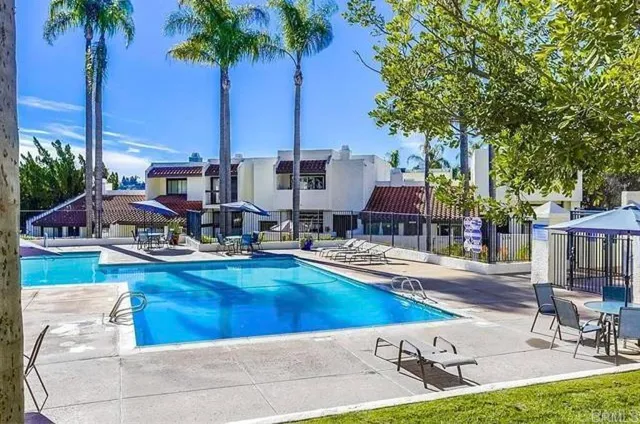 a view of a swimming pool with chairs