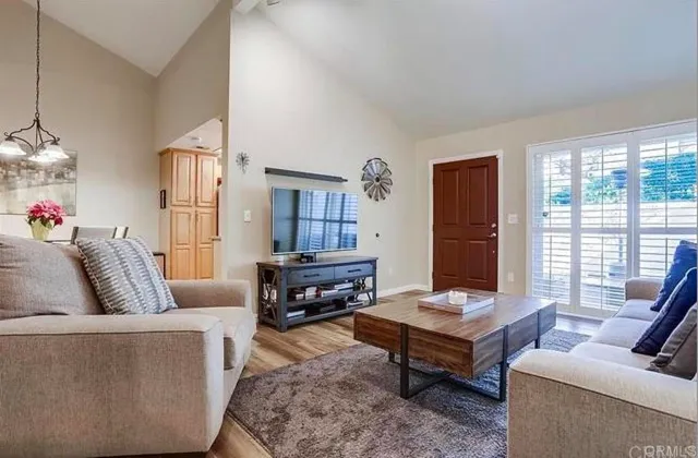 a living room with furniture and a table