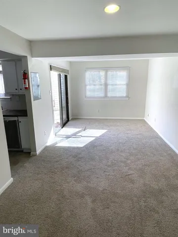 a view of empty room with windows