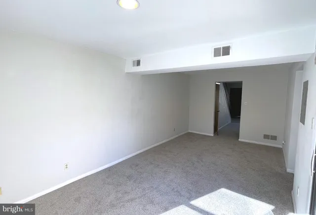 an empty room with a hallway