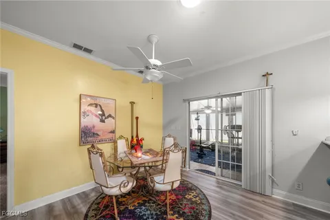 a work room with furniture and wooden floor