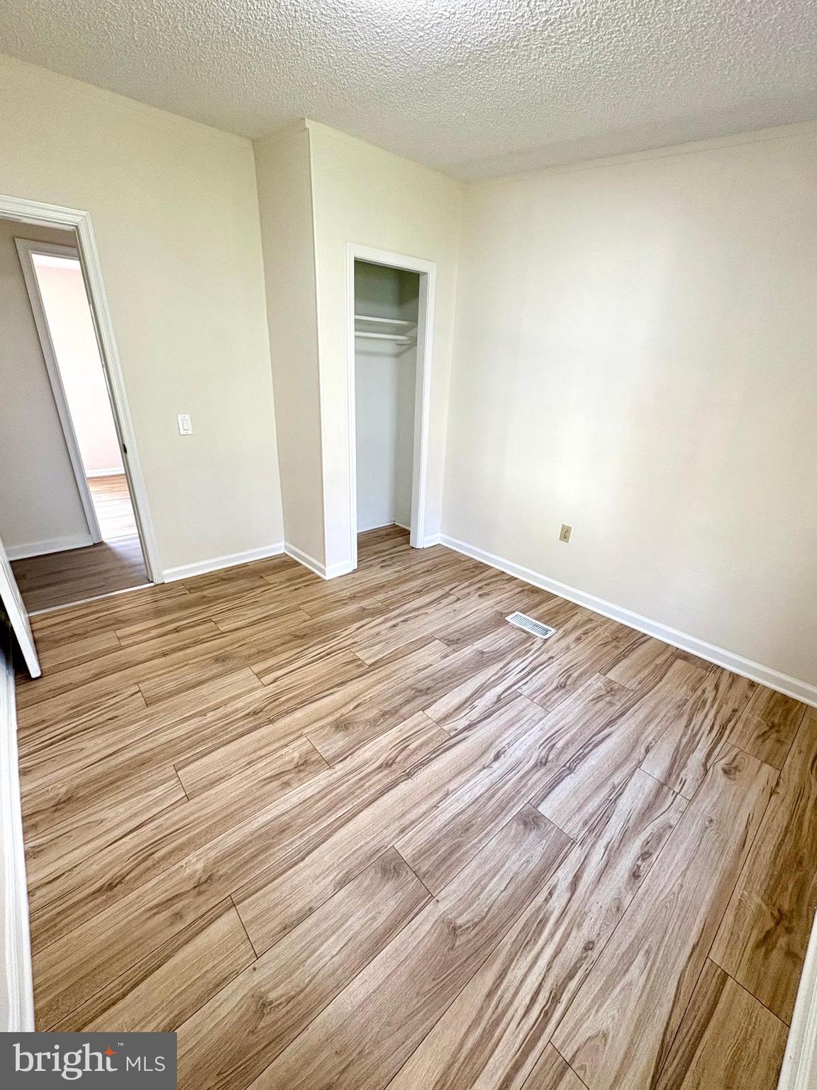 7714 Walnut Lane Mount Airy, MD 21771 - Photo 20 of 42 a view of empty room with wooden floor