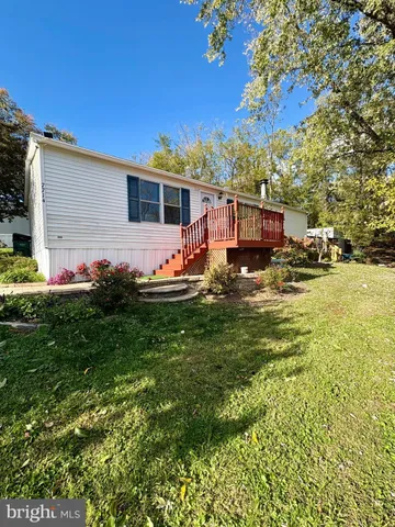 a front view of house with yard and seating area