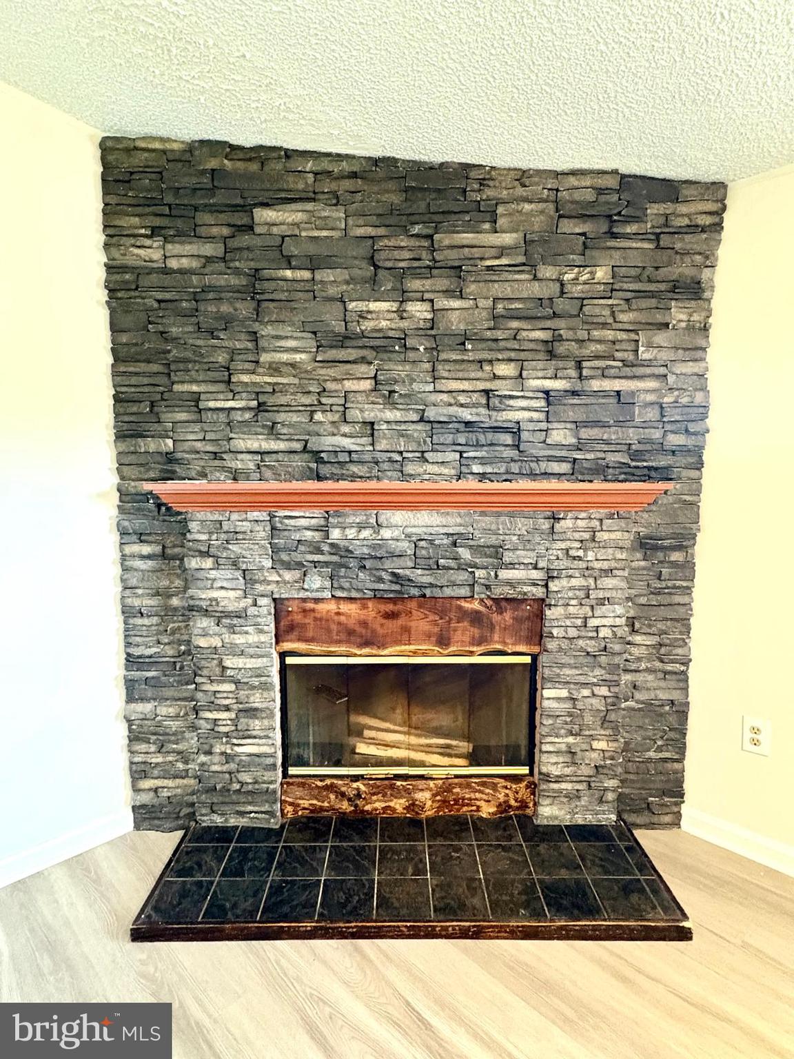 7714 Walnut Lane Mount Airy, MD 21771 - Photo 8 of 42 a view of fireplace and wooden floor