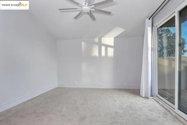 a view of a balcony with wooden floor