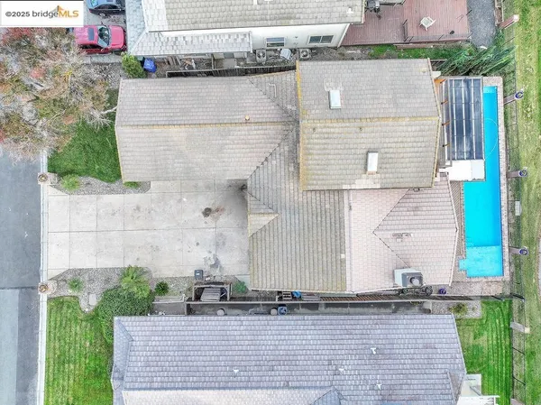 an aerial view of a house with a garden